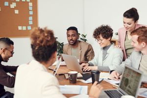 Illustrative stock photograph of an editorial team, not the actual authors
